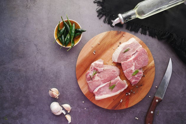 Meat on a wooden serving board.