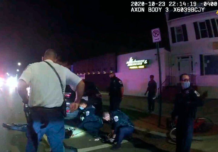 This image from a police-worn body camera shows Karon Hylton-Brown, 20, on the ground after a moped chase on Oct. 23, 2020.