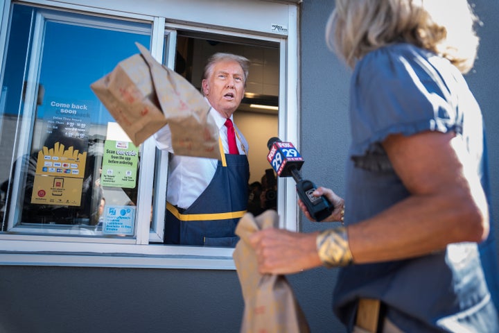 Then-Republican nominee Donald Trump speaks to reporters as he hands out food at a McDonald's in Pennsylvania.