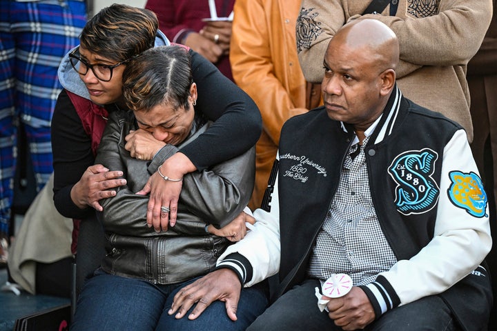 Caleb Wilson's father, Corey Wilson, right, mourns alongside other grieving family members during a vigil for the 20-year-old at Southern University on March 5, 2025, in Baton Rouge, Louisiana.