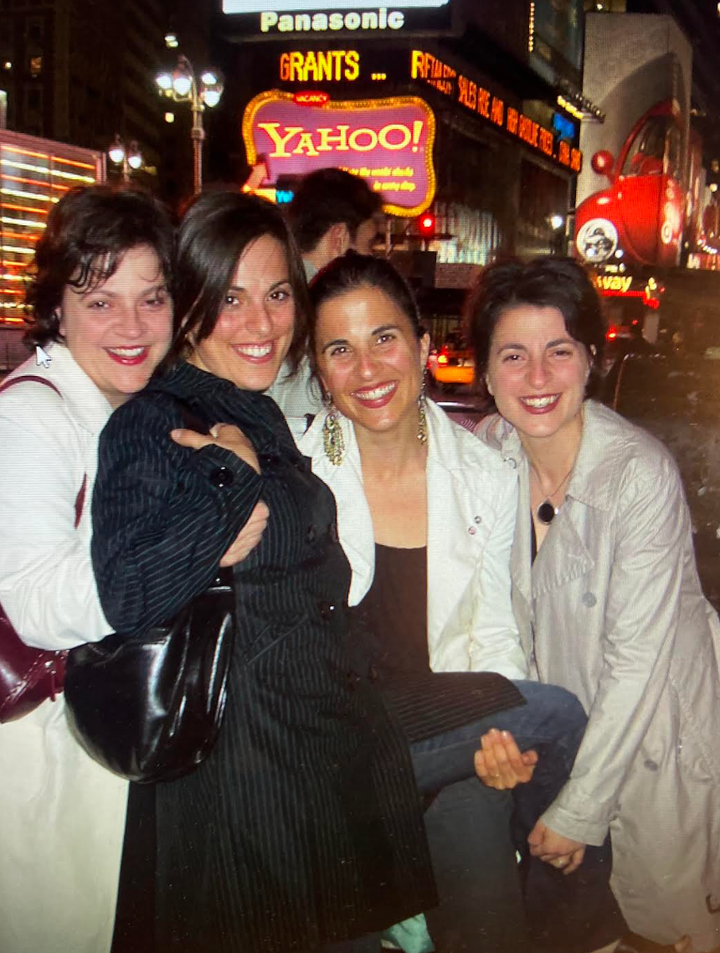 The author (second from right) on a trip to Times Square with her three sisters.