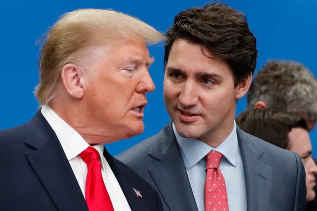 US President Donald Trump, left, and Canadian Prime Minister Justin Trudeau talk prior to a NATO round table meeting at The Grove hotel and resort in Watford, Hertfordshire, England, Dec. 4, 2019.