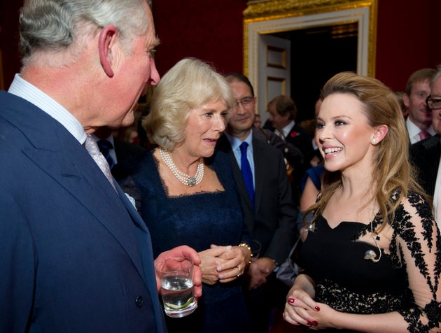 The Prince Of Wales and Duchess Of Cornwall, as they were then known, pictured in 2012 with Kylie Minogue