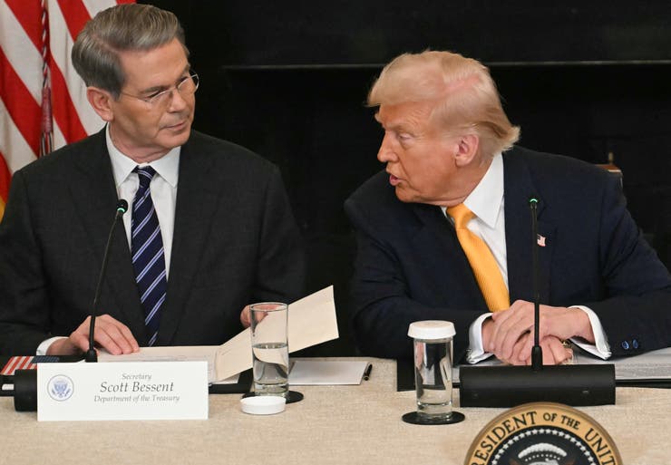 Treasury Secretary Scott Bessent and President Donald Trump attend the White House Crypto Summit on Friday in Washington, D.C.