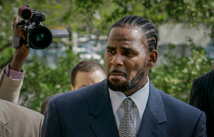 This photo shows R. Kelly arriving for the first day of jury selection in a 2008 child pornography trial at the Cook County Criminal Courthouse in Chicago. He was acquitted in the trial, though he would later be found guilty of child pornography charges in 2022.