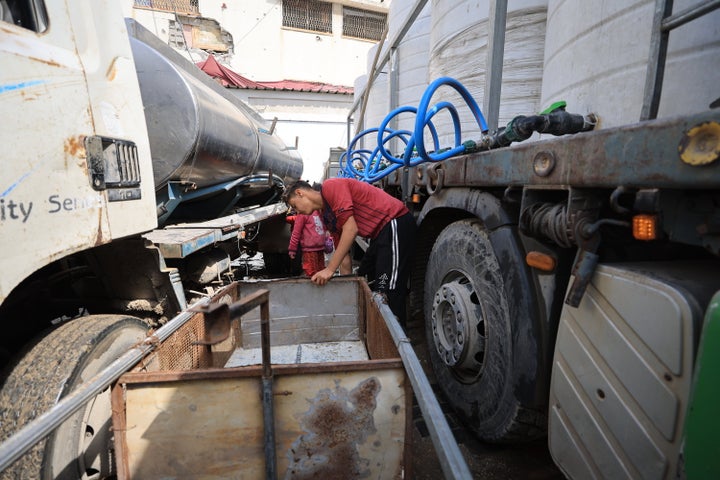 Trucks distribute water to displaced Palestinians experiencing a water crisis as a result of Israel's blockade of fuel, which has disrupted the supply of electricity to water treatment plants in the Shujaiyye neighborhood of eastern Gaza City, on March 5, 2025.