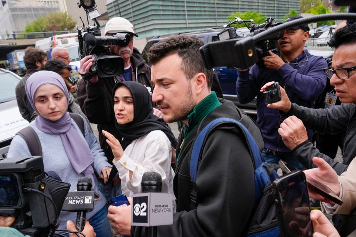 Members of the Columbia University Apartheid Divest group, including Mahmoud Khalil, center, are surrounded by media outside the university campus on April 30, 2024, in New York City.