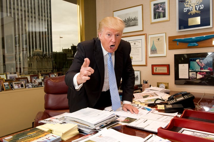 President Donald Trump pictured in 2012 pulling one of his signature poses from "The Apprentice."