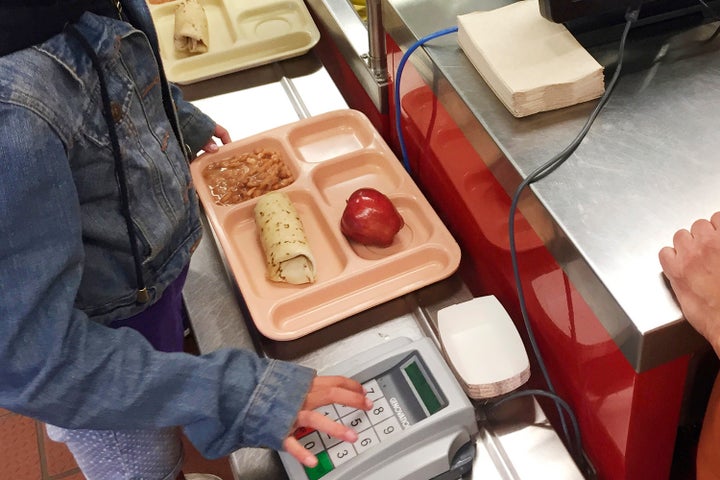 In 2017, a third grader punches in her student identification to pay for a meal at Gonzales Community School in Santa Fe, New Mexico.