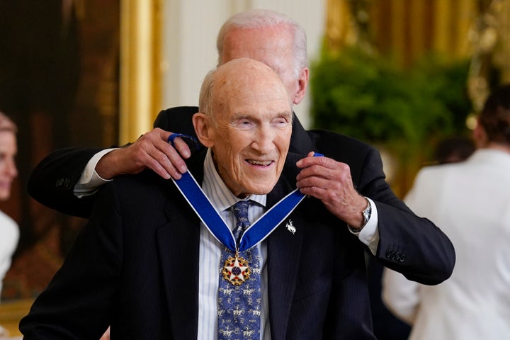 President Joe Biden awards the nation's highest civilian honor, the Presidential Medal of Freedom, to former Wyoming Sen. Alan Simpson at the White House in Washington, July 7, 2022. Simpson has died at age 93.