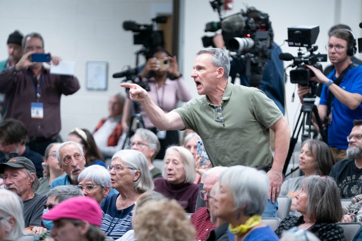 A man shouts at Rep. Chuck Edwards (R-NC) during a congressional town hall meeting on March 13, 2025 in Asheville, North Carolina. (Photo by Sean Rayford/Getty Images)