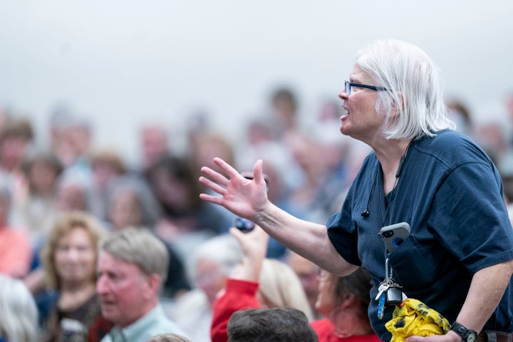 A woman questions Rep. Chuck Edwards (R-NC) during a congressional town hall meeting on March 13, 2025 in Asheville, North Carolina. (Photo by Sean Rayford/Getty Images)