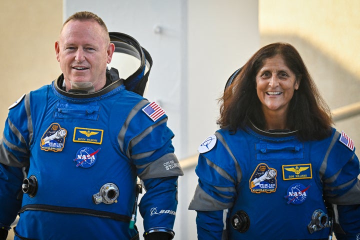 NASA astronauts Butch Wilmore (L) and Suni Williams, wearing Boeing spacesuits, depart the Neil A. Armstrong Operations and Checkout Building at Kennedy Space Center for Launch Complex 41 at Cape Canaveral Space Force Station in Florida to board the Boeing CST-100 Starliner spacecraft for the Crew Flight Test launch, on June 5, 2024.