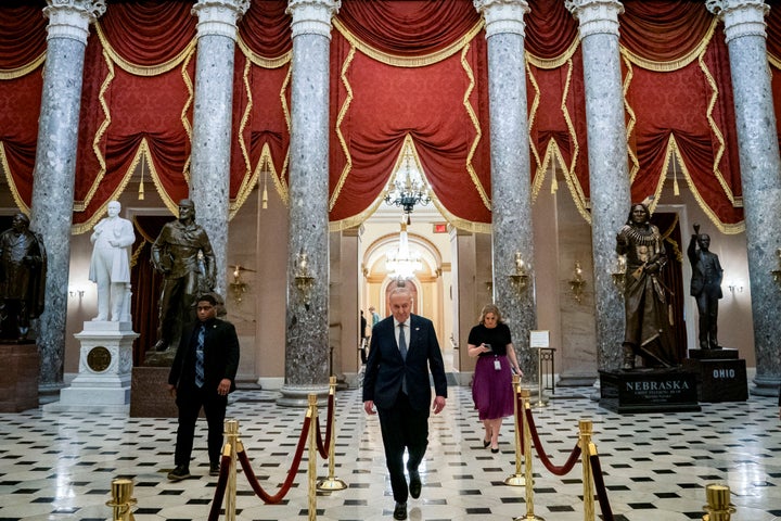 Senate Minority Leader Chuck Schumer, a Democrat from New York, center, in Statuary Hall at the U.S. Capitol in Washington, DC, US, on Friday, March 14, 2025. (Photographer: Allison Robbert/Bloomberg via Getty Images)