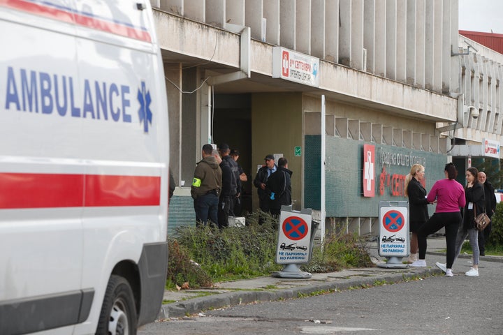 People wait in front of the hospital in Skopje, North Macedonia, Sunday, March 16, 2025, after a massive fire in a nightclub in the town of Kocani. (AP Photo/Boris Grdanoski)