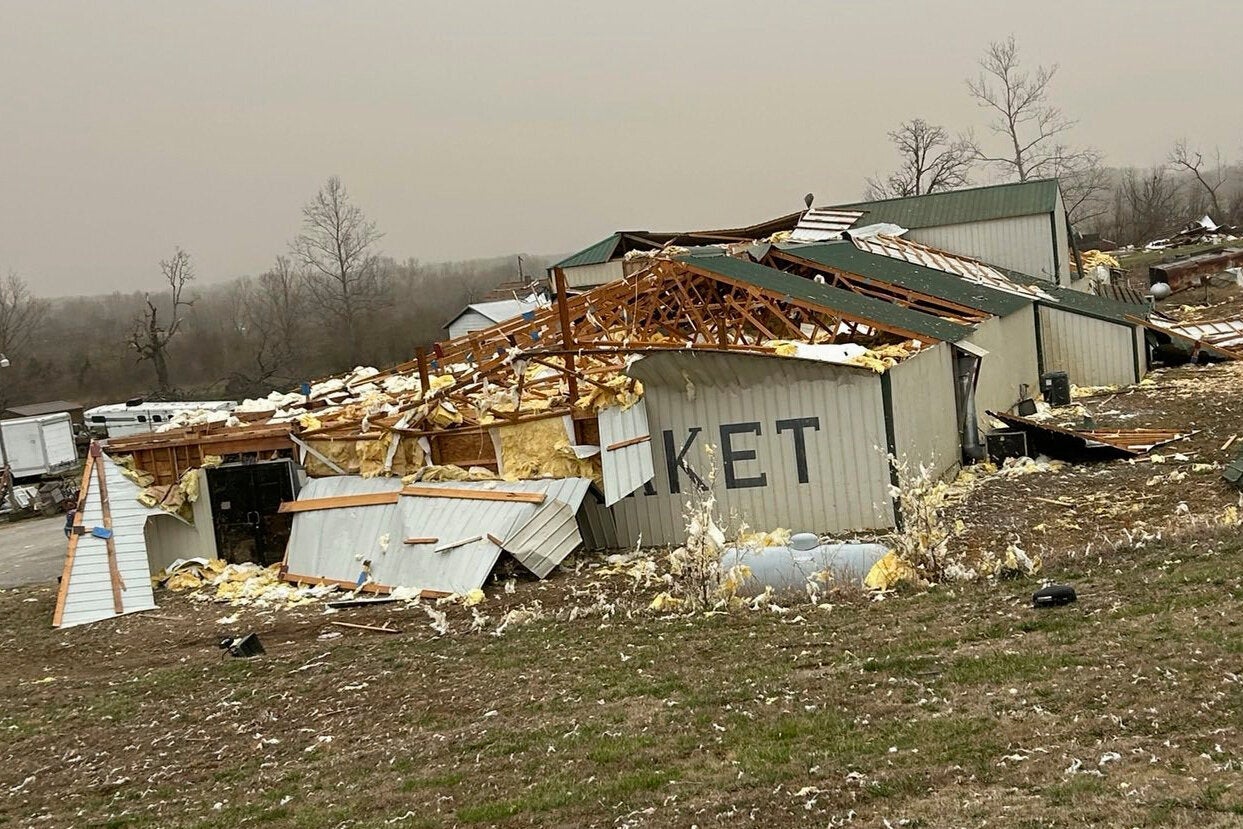 A home is damaged after a severe storm passed the area near Ozark County, Mo., on Saturday.