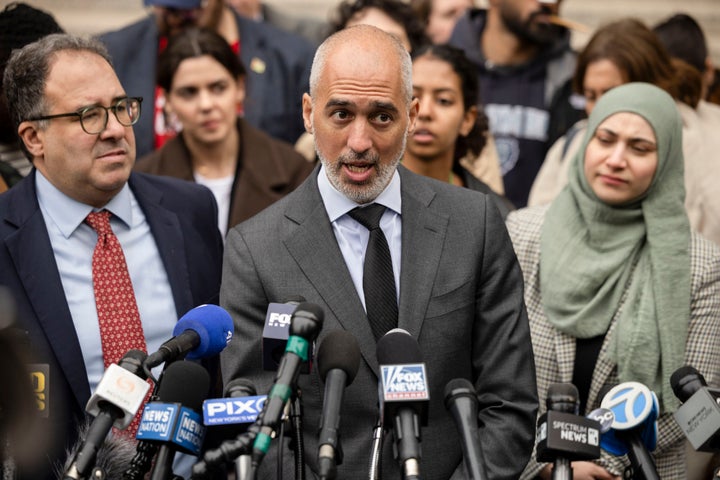 Baher Amzy (left) and Ramzi Kassem (center), attorneys for Mahmoud Khalil, speak outside of the Thurgood Marshall U.S. Courthouse in New York, on Wednesday, March 12, 2025. 