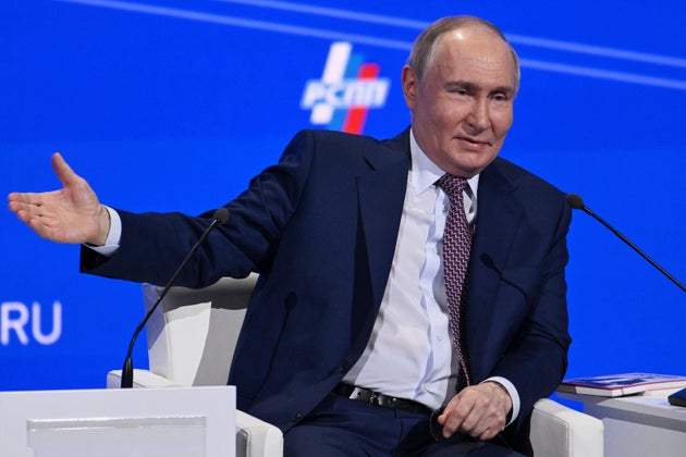 Vladimir Putin gestures while speaking at the annual congress of the Russian Union of Industrialists and Entrepreneurs in Moscow.