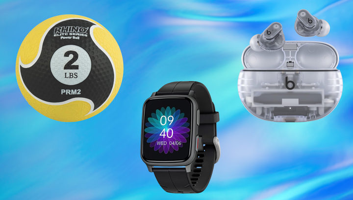 Medicine ball, fitness tracker and earbuds