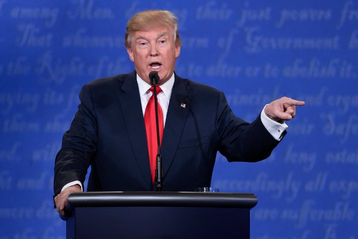 President Trump, then a presidential candidate, points to Hillary Clinton during their final debate in October 2016.