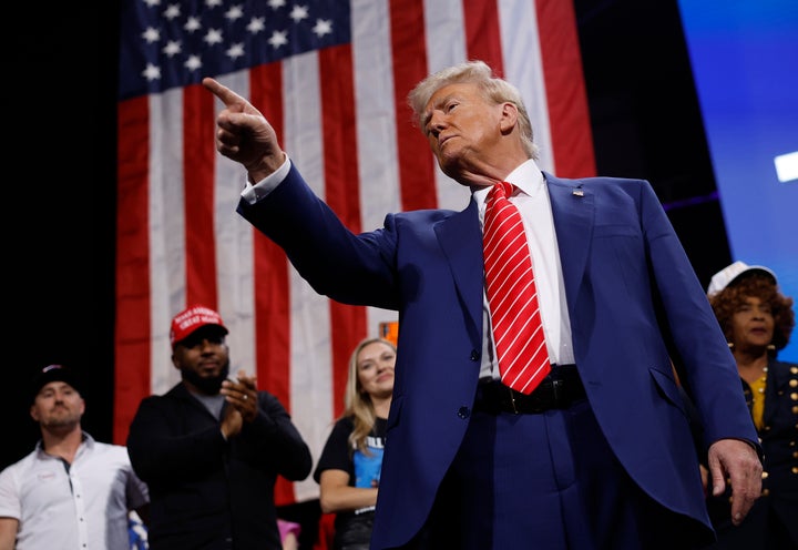 Donald Trump points to the crowd after delivering remarks during a campaign rally at the Cobb Energy Performing Arts Centre on Oct. 15, 2024, in Atlanta.