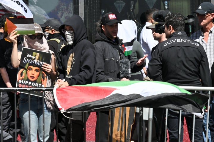 Protesters attend the ceremony honoring Gadot.