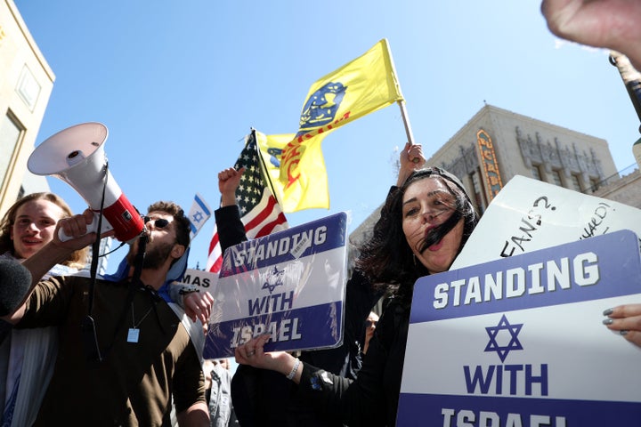 Pro-Israel people protest in front of the El Capitan Theater during Gadot's Hollywood Walk of Fame star ceremony.