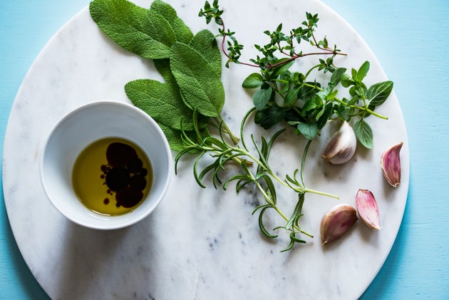 A selection of fresh herbs on a marble plate