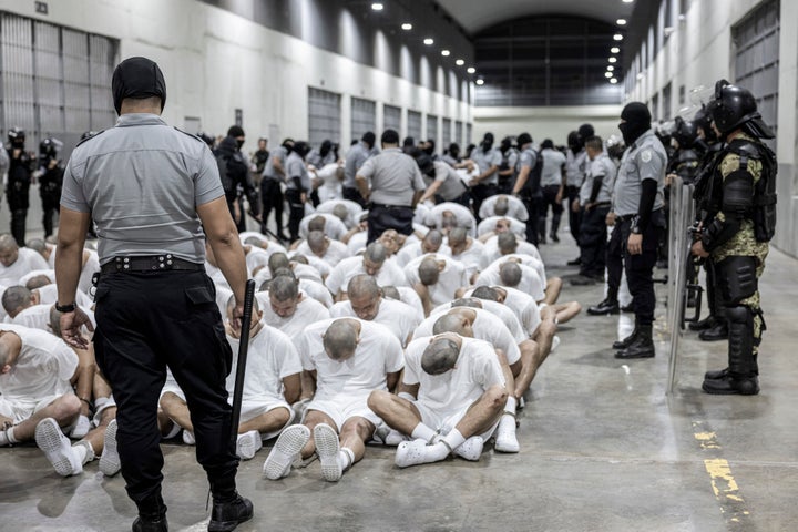 Migrants sent from the U.S. are seen at the notorious CECOT prison in El Salvador on Sunday.