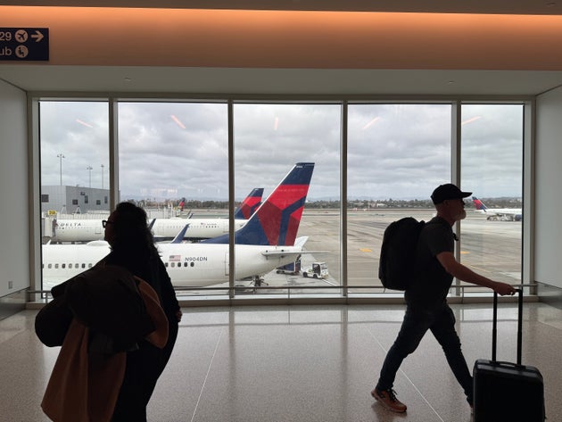Los Angeles, California-October 28, 2024: Passengers walking on the concourse of Delta's terminal 3 at Los Angeles International Airport. Delta's West Coast Hub is based in LAX.