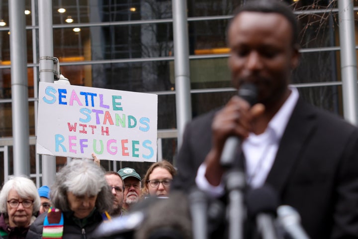 Tshishiku Henry, a former refugee and Washington State Delegate for the Refugee Congress, speaks during a rally outside the U.S. District Court after a federal judge blocked Trump's effort to halt the nation's refugee admissions system in February. Trump has faced a lot of setbacks in federal courts.