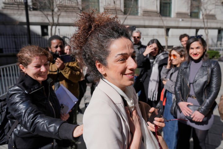 Masih Alinejad greets friends and supporters outside the federal courthouse after testifying at the trial of two men accused of plotting to kill her in New York.