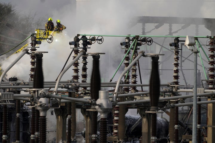 Firefighters extinguish the fire at the North Hyde electrical substation, which caught fire Thursday night and lead to a closure of Heathrow Airport in London, Friday, March 21, 2025.(AP Photo/Kirsty Wigglesworth)