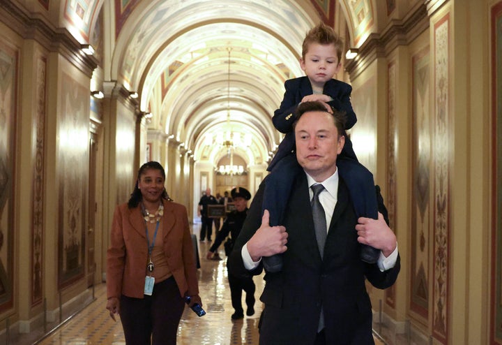 Elon Musk arrives on Capitol Hill with his son in December in Washington.