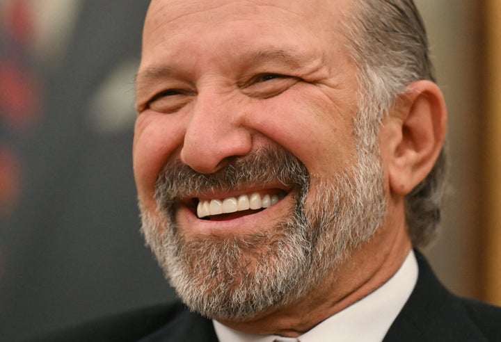 Secretary of Commerce Howard Lutnick looks on in the Oval Office of the White House on Feb. 21.