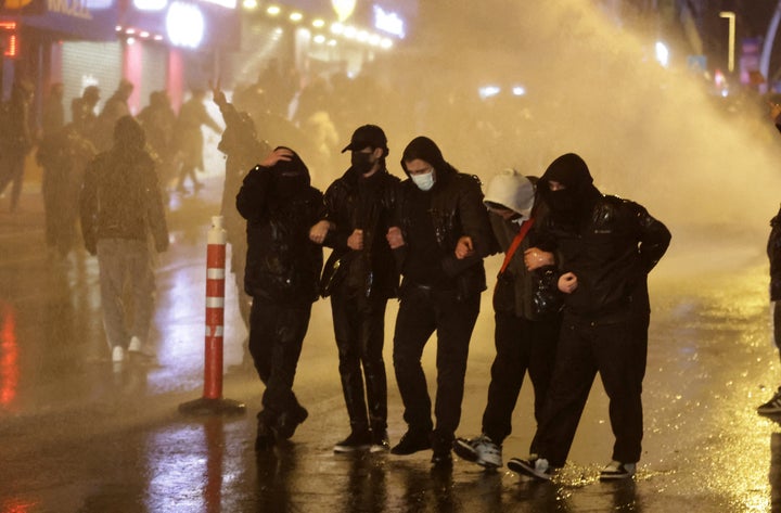 Protesters clash with Turkish anti riot police as they use tear gas and water cannons during a demonstration following the arrest of Istanbul's mayor, in Ankara on March 21, 2025. Thousands have rallied in Istanbul for a third night of demonstrations in support of its arrested mayor Ekrem Imamoglu -- the incumbent president's chief political rival -- who was detained just days before he is expected to be formally named as a candidate in the country's 2028 presidential election. The arrest, over two investigations into graft and "supporting terror", is described by Imamoglu's opposition party CHP as a politically-motivated "coup". (Photo by Adem ALTAN / AFP) (Photo by ADEM ALTAN/AFP via Getty Images)