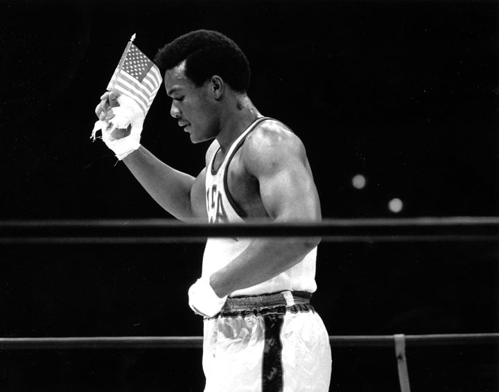 George Foreman waved an American flag after defeating Soviet boxer Jonas Čepulis at the 1968 Olympic Games in Mexico City. California, waves an American flag after winning the Olympic gold medal at the Mexico City games on Oct. 27, 1968. Foreman won by a technical knockout in the second round against Iones Chepulis of Russia. (AP Photo/Kurt Strumpf)