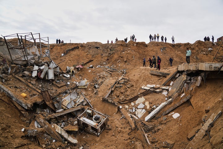 Palestinians inspect the rubble of a structure hit by an Israeli bombardment in Deir al-Balah, Gaza Strip on Saturday, March 22, 2025. (AP Photo/Abdel Kareem Hana)