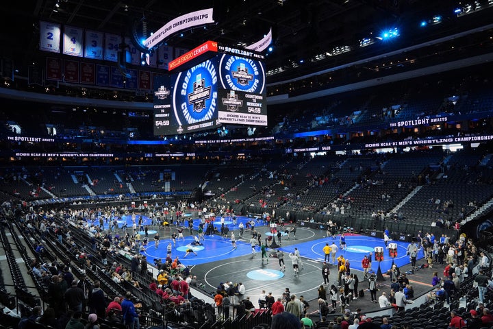 Wrestlers warm up ahead of the NCAA wrestling championships, Thursday, March 20, 2025, in Philadelphia. (AP Photo/Matt Rourke)