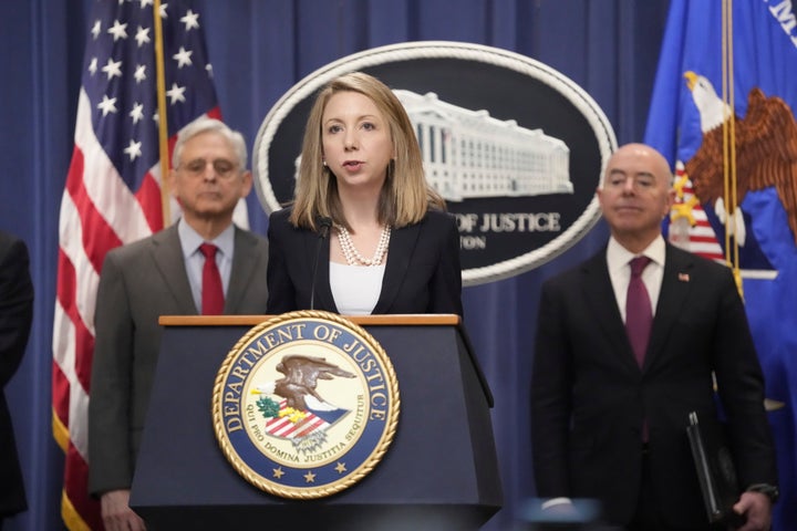 U.S. Attorney Jessica Aber for the Eastern District of Virginia, speaks with reporters during a news conference at the Department of Justice, on Dec. 6, 2023, in Washington, as Attorney General Merrick Garland (left) and Secretary of Homeland Security Alejandro Mayorkas, look on.