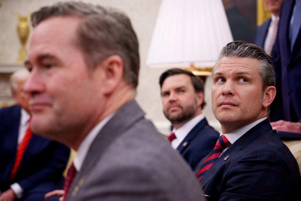 President Donald Trump, U.S. National Security Adviser Michael Waltz, U.S. Vice President J.D. Vance, and Defense Secretary Pete Hegseth, listen to a question from a reporter during a meeting in the Oval Office of the White House on March 13, 2025 in Washington, DC.