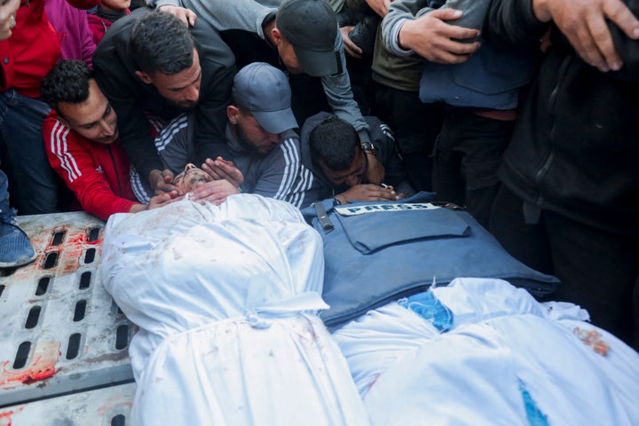 Family and friends mourn over the bodies of Palestine Today journalist Mohammad Mansour (L) and Al Jazeera journalist Hossam Shabat (R), both of whom were killed by Israeli forces on March 24, 2025 in the Gaza Strip, Palestinian territories. 