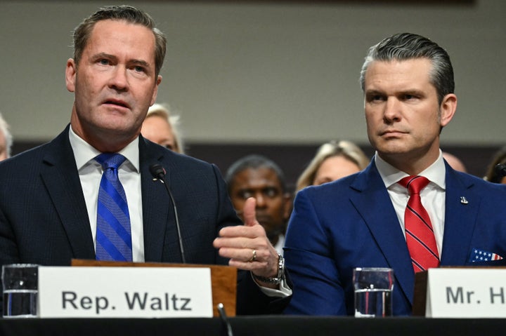 Pete Hegseth, right, is seen with Michael Waltz, left, on Jan. 14 in Washington. The pair allegedly discussed plans to bomb Houthi rebels in Yemenin a group chat that inadvertently included a journalist.