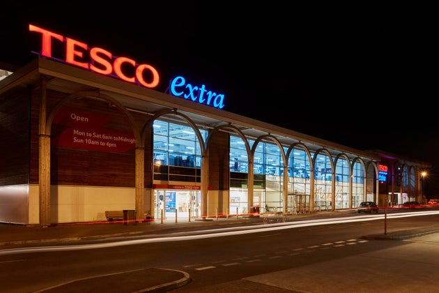 Tesco Extra entrance at night.
