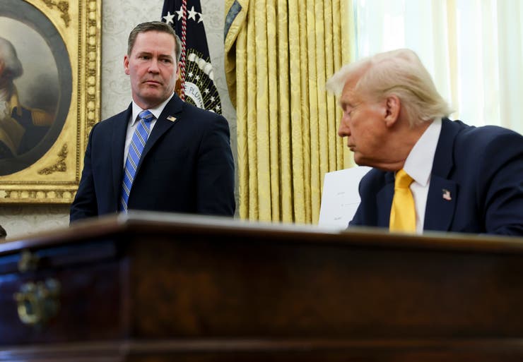 White House national security adviser Mike Waltz listens as President Donald Trump speaks in the Oval Office of the White House in Washington, March 7, 2025.