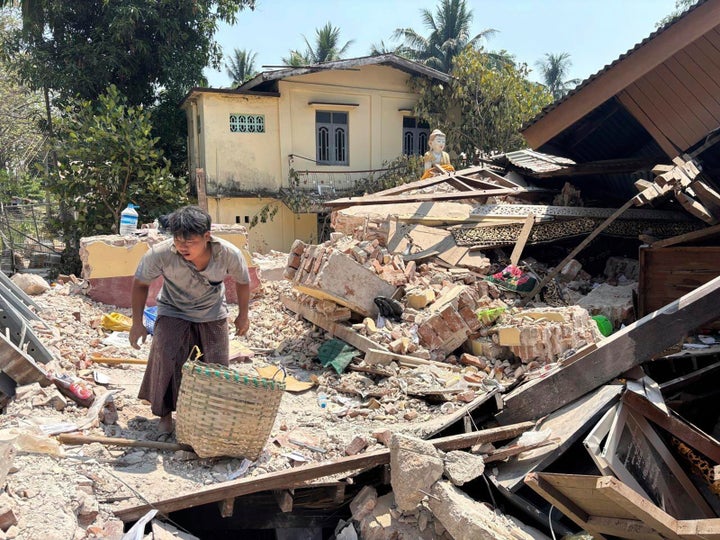 Scent Of Loss of life Permeates Myanmar Cities After Quake Kills Over 1,600 And Leaves Numerous Buried 1 A person goes through rubble at a Buddhist monastery building that has collapsed following an earthquake in Naypyitaw, Myanmar Sunday, March 30, 2025. (AP Photo/Aung Shine Oo)