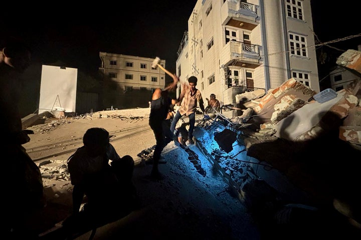 Scent Of Loss of life Permeates Myanmar Cities After Quake Kills Over 1,600 And Leaves Numerous Buried 3 Rescuers work to find survivors in a house that collapsed after an earthquake in Mandalay, Myanmar, Saturday, March 29, 2025. (AP Photo/Thein Zaw)