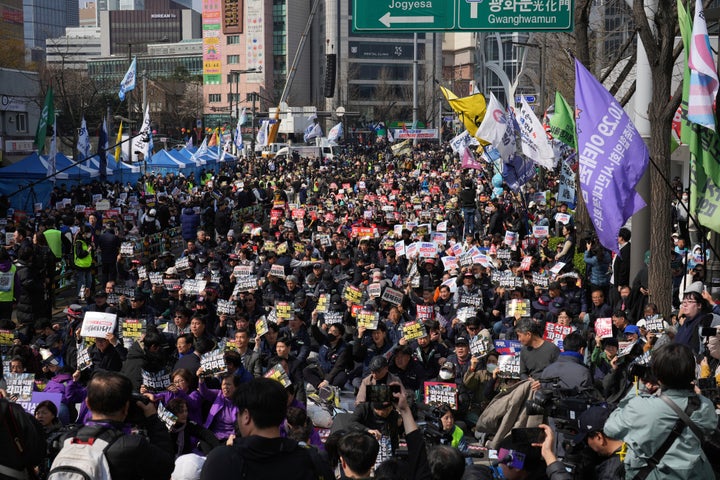 People shout slogans during a rally calling for impeached South Korean President Yoon Suk Yeol to step down near the Constitutional Court in Seoul, South Korea, Friday, April 4, 2025. (AP Photo/Lee Jin-man)