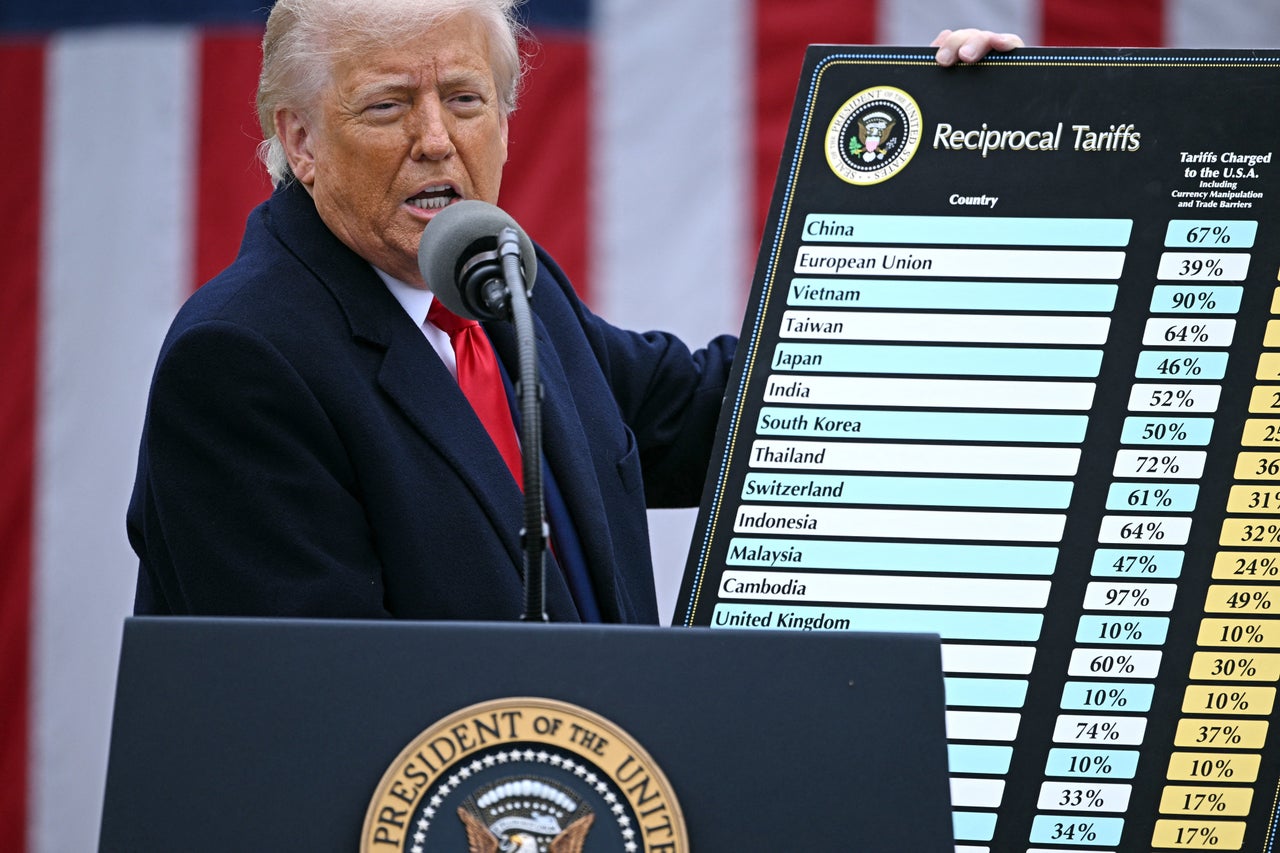 US President Donald Trump holds a chart as he delivers remarks on reciprocal tariffs during an event in the Rose Garden entitled "Make America Wealthy Again" at the White House in Washington, DC, on April 2, 2025. Trump geared up to unveil sweeping new "Liberation Day" tariffs in a move that threatens to ignite a devastating global trade war. Key US trading partners including the European Union and Britain said they were preparing their responses to Trump's escalation, as nervous markets fell in Europe and America. (Photo by Brendan SMIALOWSKI / AFP) (Photo by BRENDAN SMIALOWSKI/AFP via Getty Images)