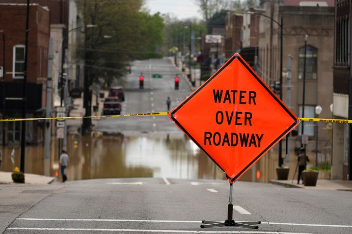 A street is closed off due to flood waters in Hopkinsville, Ky., Friday, April 4, 2025. (AP Photo/George Walker IV)
